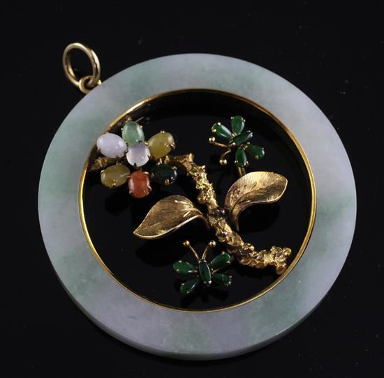 A 14ct gold, jade and cabochon gem set open disc pendant, 2.25in.